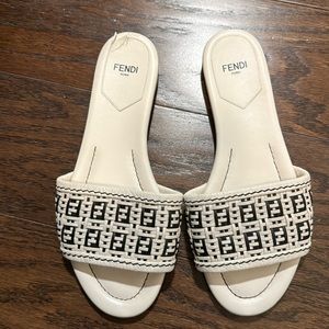 White Fendi logo sandal slides.